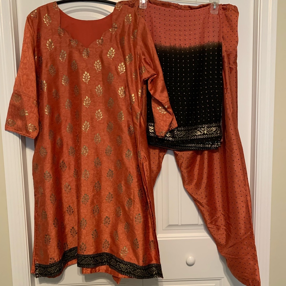 Elegant Orange Traditional Outfit with Gold and Black Accents